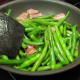 Stir Green Beans and Bacon.