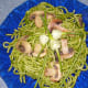 Decorate your pasta dish with the same ingredients used in the recipe. Enjoy!