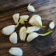 Garlic cloves ready to be planted. For the best results, seek out certified cloves from reputable garden centers, or use organic cloves from the grocery store.