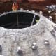 A bio-digester dome under construction.