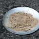 I buried the metal basin of a broken birdbath in a flowerbed and filled it with a few handfuls of sandy soil.