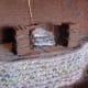 Building adobe fireplaces.