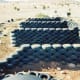 Rammed earth tire walls in typical U pattern for Earthships.