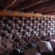 Earthship interior rammed earth tire walls before mudding.