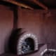 Building adobe fireplaces.