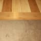 No trim; carpet tucked into the flooring groove