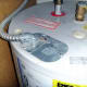 Electrical cover plate: Note the bare ground wire fastened to the top of the plate.