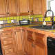 Consider how main color works with cabinets, floors and general design of room.