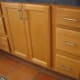 Home Depot cabinets have cheaper doors and a wide space between drawers.