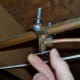 This is a typical saddle valve for a water line. Yours may be built into the line itself.