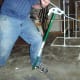 Note how the bender handle is "caught" with the users foot and leg. It is common for the handle to slip on the floor and kick out, ruining the bend and possibly causing injury if it isn't held somehow.