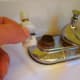 Wiggle, wiggle and ta-da, it's out. Place the new one in and put the faucet back together the same way it came apart.