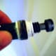 Now, with the new washer on, be sure to wrap teflon tape around the threads to seal the valve when reinserted.