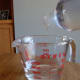Mix a half cup of liquid soap with your hot vinegar.