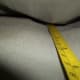 Locate back side of couch frame underneath the top back cushions.