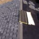 The shingles were removed from the right side here, leaving a good layer of felt. It does not need replacement.
