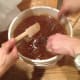 You can see the filter. Without the filter bee bits and wax cappings would be in your honey.
