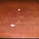 The desktop was both gouged and simply wearing through the faux surface in hundreds of small spots.