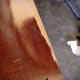 The very edge of the desk has pushed up and needed sanded smooth with the rest of the surface.