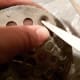 Use tip of scissors to poke a hole in the screen for the screws.