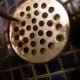 Line up the screen under the drain. It should stick out just a bit. Screw in the screws. You are done!