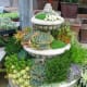 A tiered planter like this one is ideal for a central display on a balcony or deck, where guests can ooh and aah at your talent for gardening.