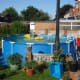 The pool on the patio, view from the garden