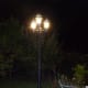 Lamppost on decking at night.