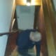 Husband, begrudgingly helping with carpet removal.