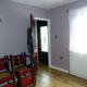 Room decorated; dining room door open, with internal porch door in view.