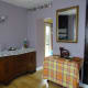 Room decorated; view into kitchen.