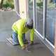 The next step was hand smoothing. The surface isn't getting stepped on at this point, so the worker used a platform to distribute his weight while he trowels the cement smoother still. He went over the same area several times.