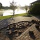 We started the removal ourselves, so that a friend could have some of the pavers for her patio. It was hard work with inadequate tools (a trowel, crowbar, and a shovel)