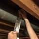 Peel the tape backing off a little at a time as you start taping