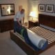 My husband unzips the inner bag after placing it on the bed, revealing the mattress inside.
