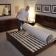 After cutting the first layer of plastic with the included safe cutting device, the bed can now be unrolled. It's still being compressed by one more layer of plastic. Make sure it's right side up!
