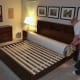 The mattress is tightly rolled and compressed inside two layers of plastic.