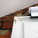 Decorative hook to hold pull chain out of way of door when not required for operating the blind.