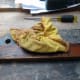 Polishing the beeswax polish with a yellow duster.