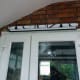 Roller blind fitted above doors.