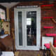 French doors, viewed from conservatory, with roller blind fitted above doorframe.