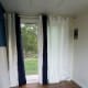 Curtains hung and white board ready for installation.