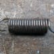 The loop at the end of the coiled spring snapped off.