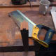 Using a tenon saw to cut the width of the tenon joint.