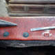 Easing the upholstery tacks out one by one.