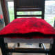 Axminster carpet squares laid in position, and ready to fit the leather seat cover on top.