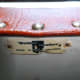 Manufacturer’s label reaffixed to the underside of the chair’s seat.