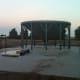 It is by no means perfect, but the slab is essentially level and very sturdy. The site was prepared by scraping dirt and rocks away, and bringing in sand.