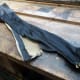 Spare 5 foot zip salvaged from the recycled faux leather; for potential recycling.