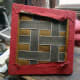 The underside of the seat prior to removing the staples.